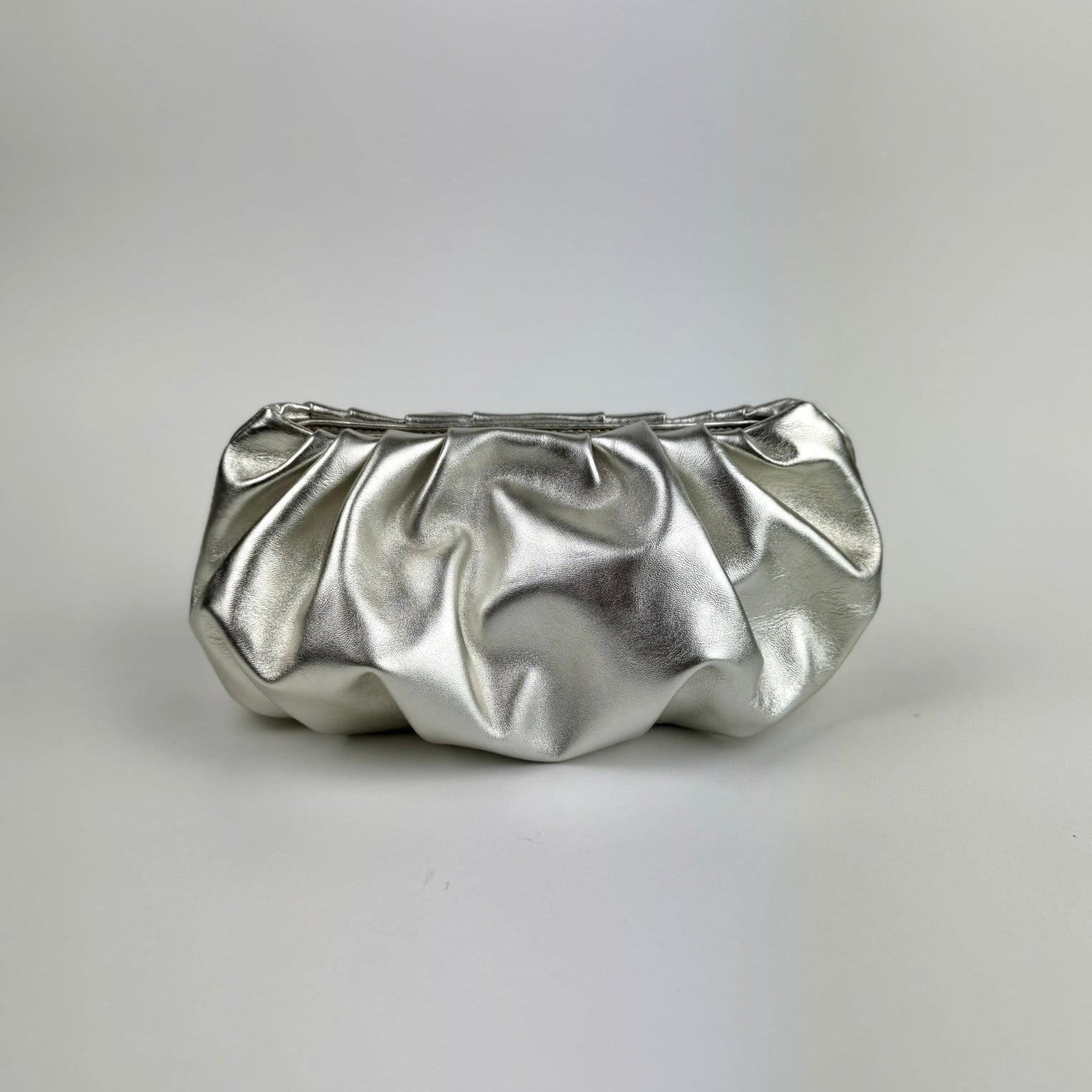 Champagne clutch bag on a white background