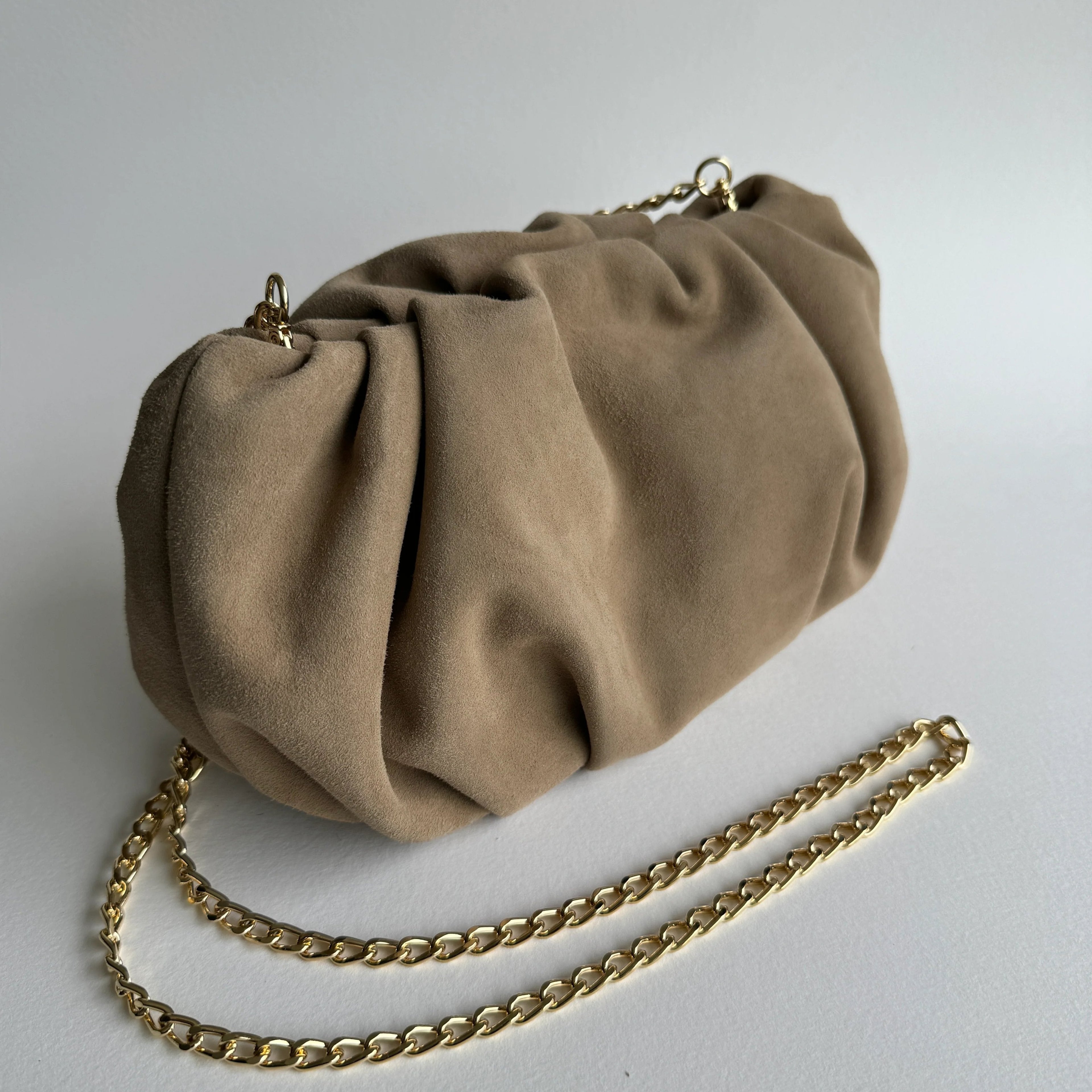 Jacky clutch in sandbeige suede with detachable strap - side view with strap