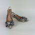 Pair of faux python slingback kitten heels on a white background