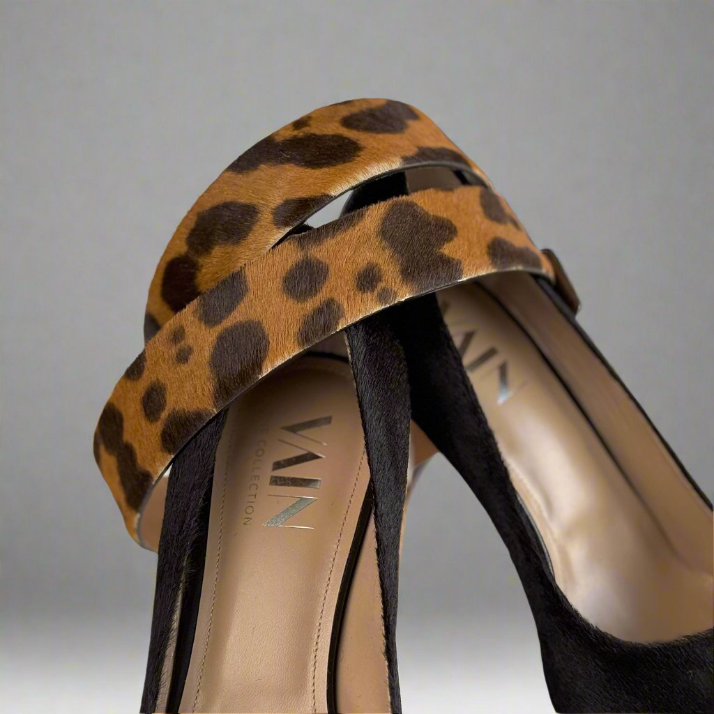 detail of matching leopard belt with dark brown high heels