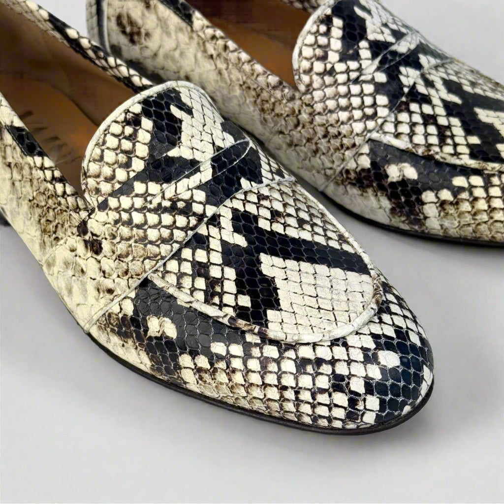 detail of the tip of faux python loafers for women