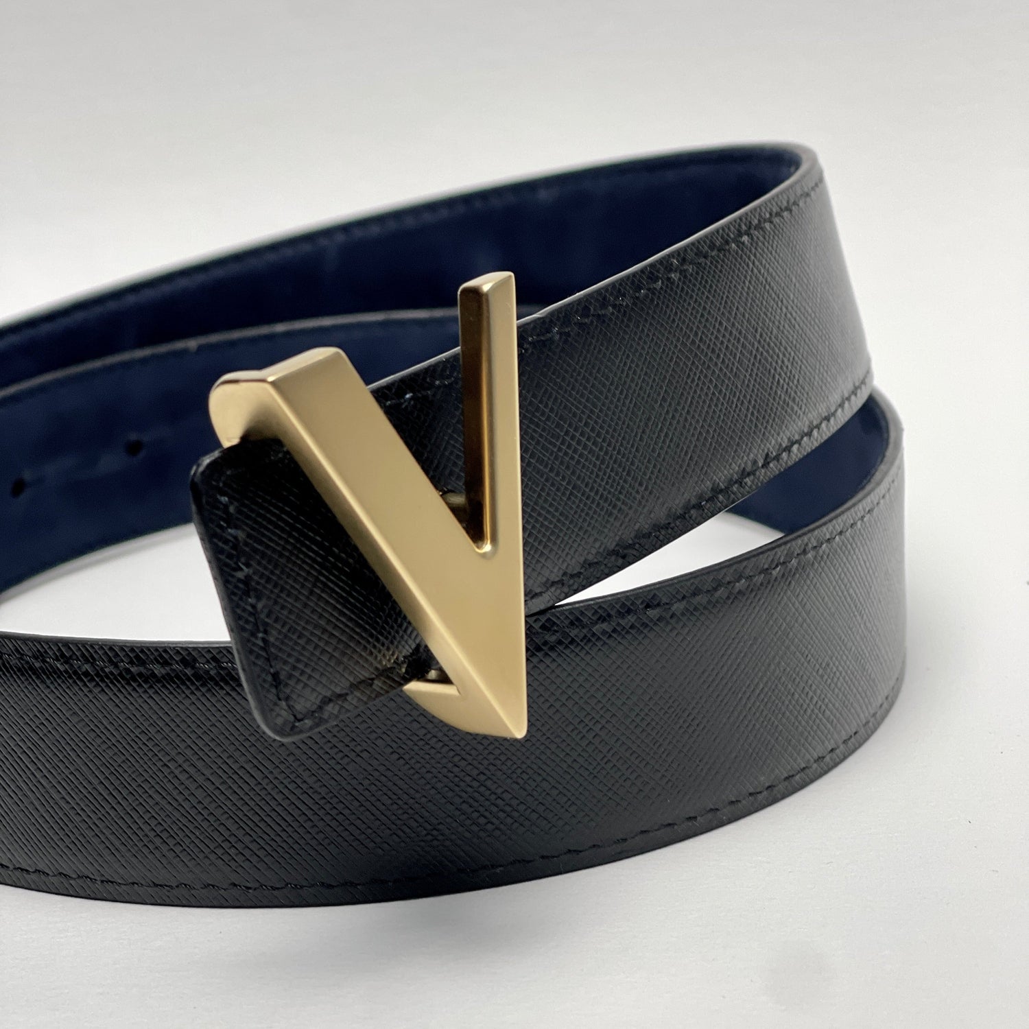 gold brushed buckle with reversible blue and black Italian leather belt strap