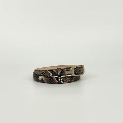 A brown and black snakeskin-patterned belt with a bronze-toned metal buckle, displayed on a clean white background.