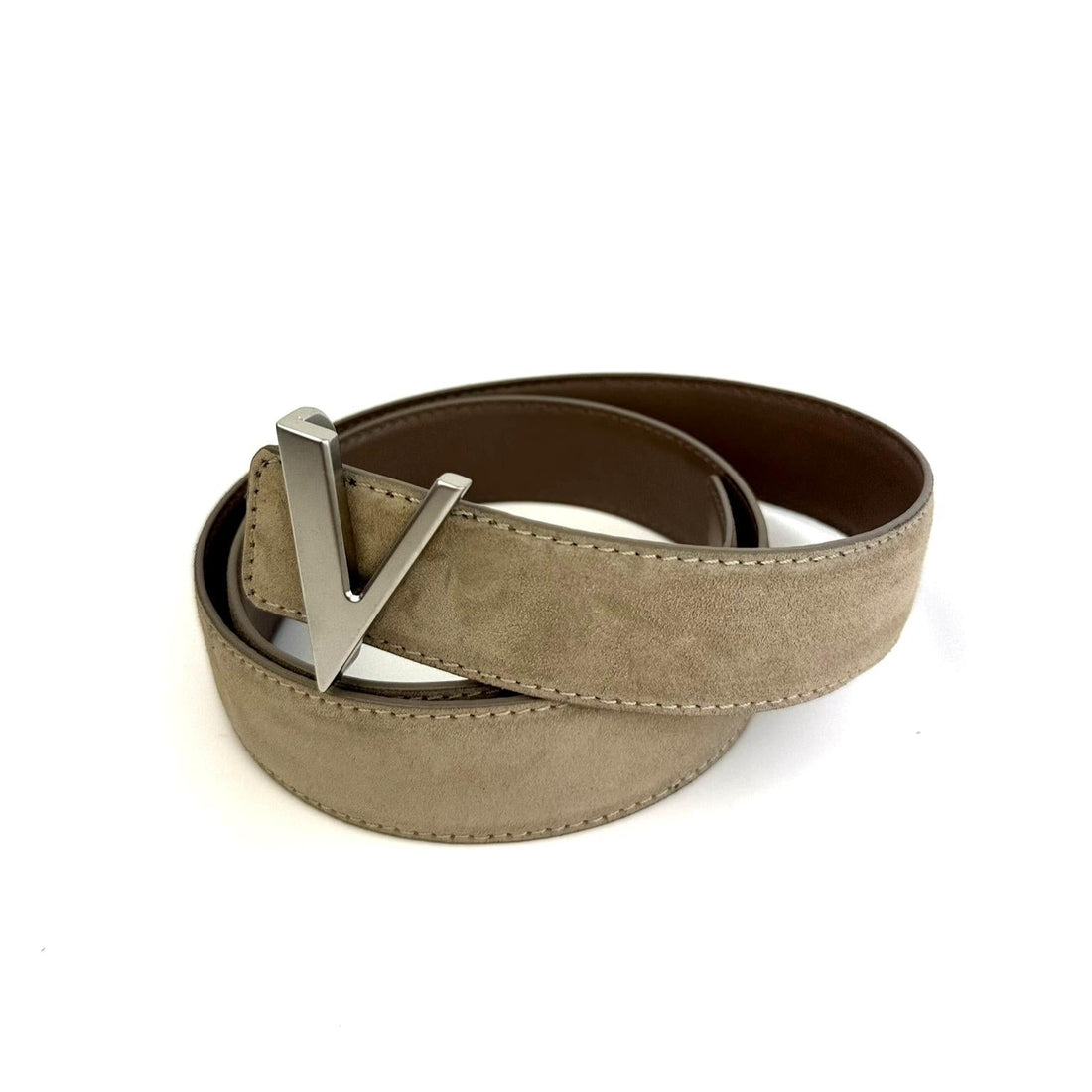 Beige suede reversible belt with silver buckle on a white background