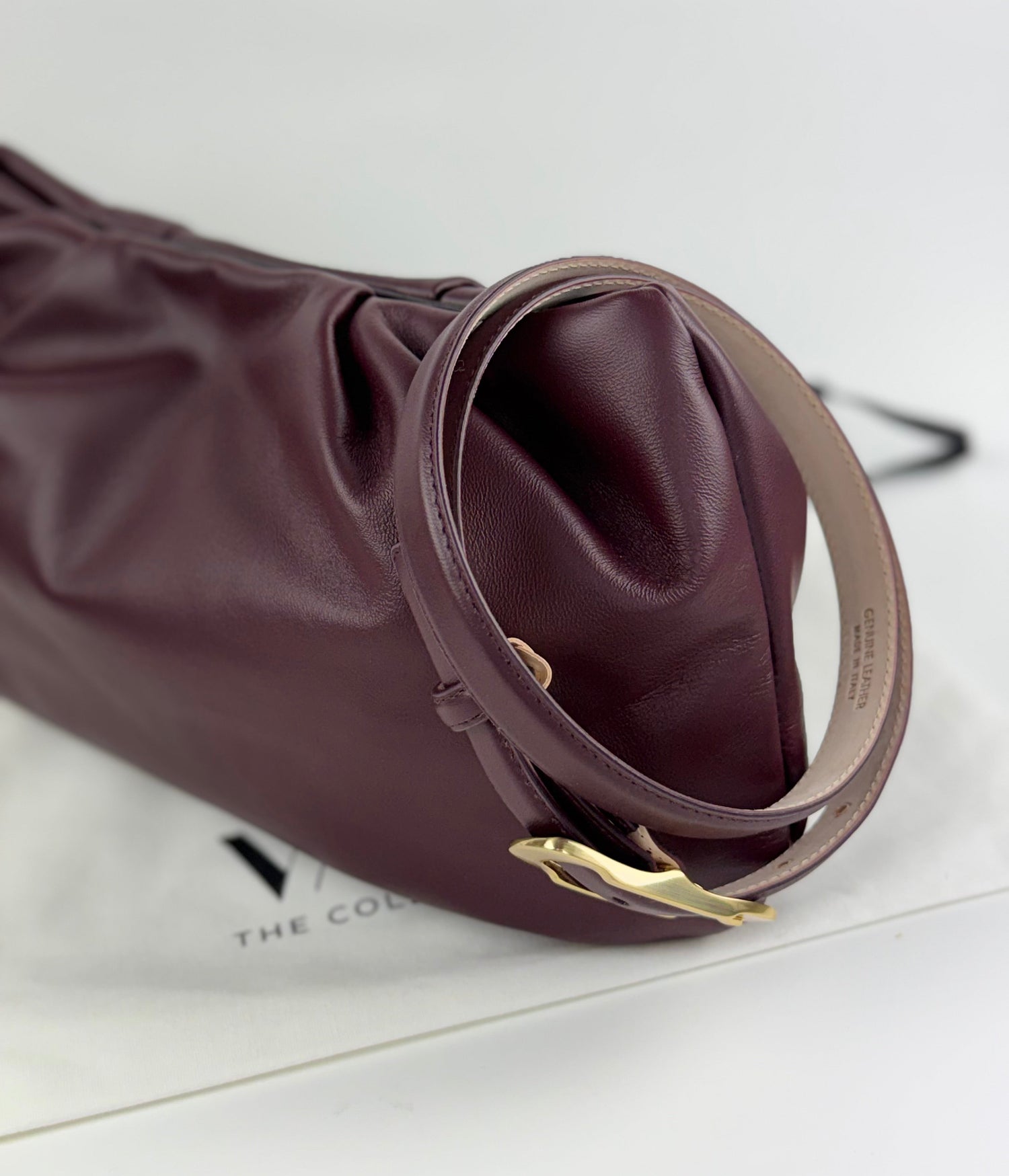 Burgundy belt and matching leather large clutch