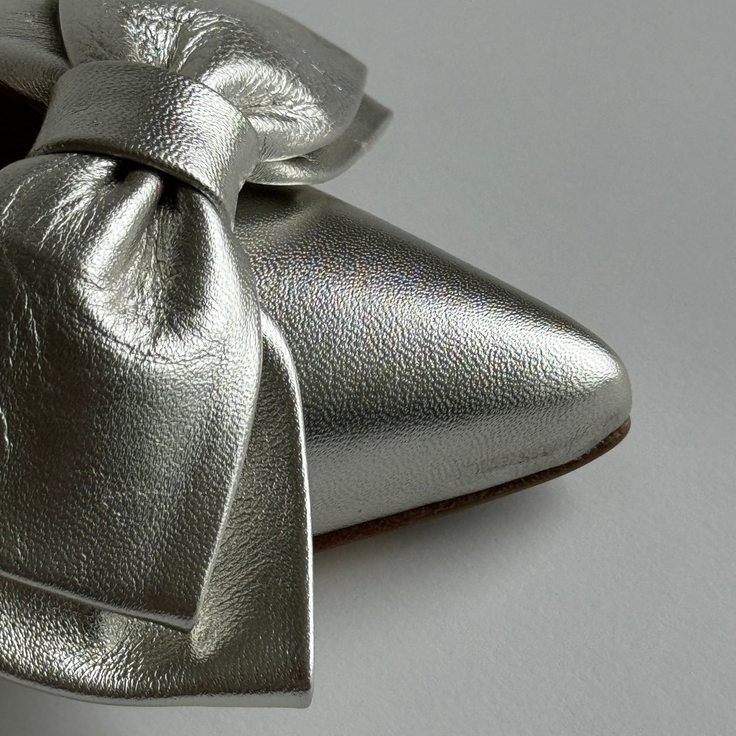 Champagne_coloured_slingback_kitten_heels_with_bows_detailed_view_of_tip