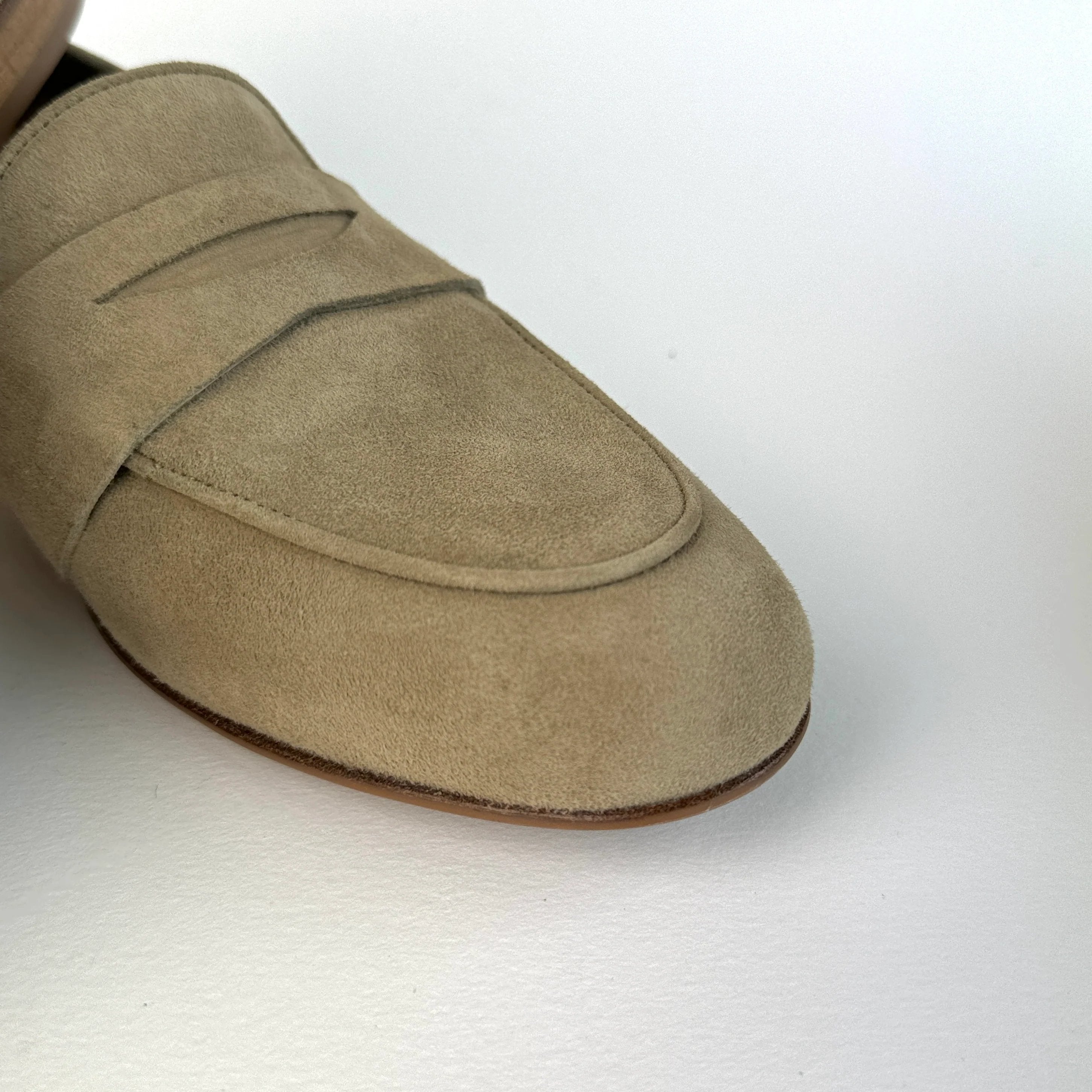 detail of sand beige loafers for women