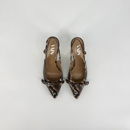 A pair of pointed-toe slingback pumps featuring a brown and black snakeskin pattern, displayed on a light gray background.