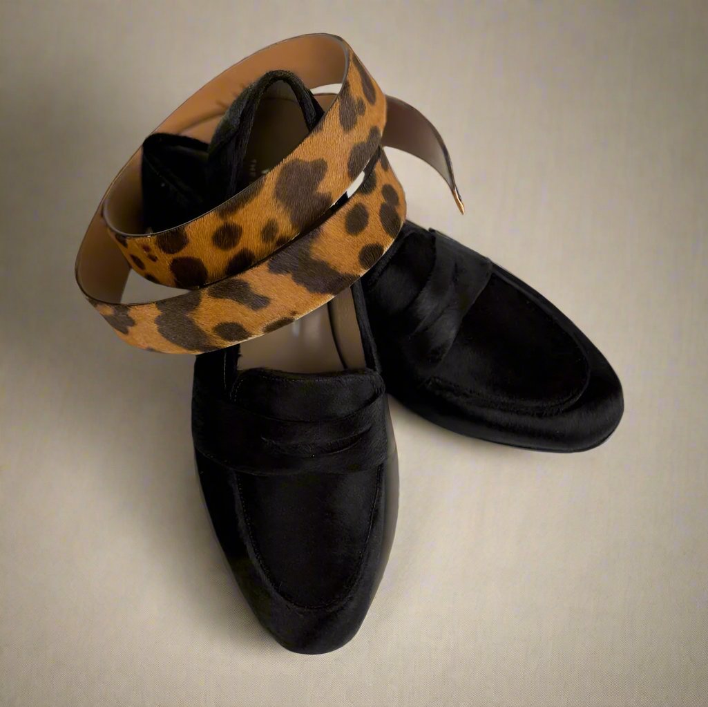 dark brown pony loafers with matching leopard printed pony belt wrapped around the shoes