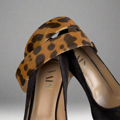 detail of matching leopard belt with dark brown high heels