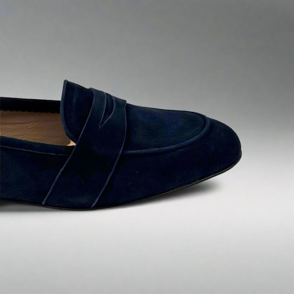 detail of tiop of midnight blue suede loafers for women
